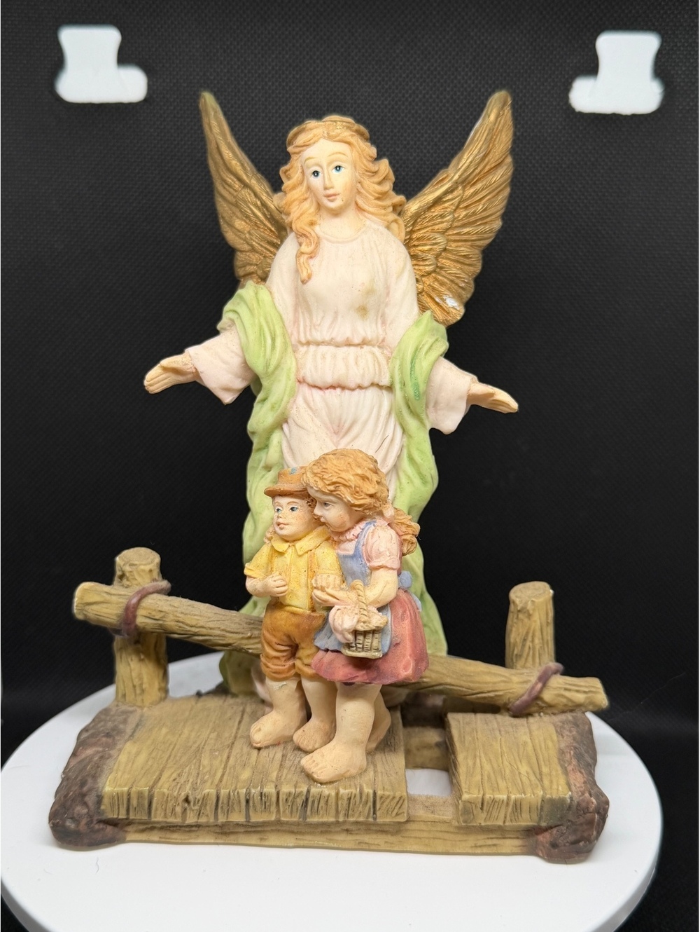 Angel with children figurine